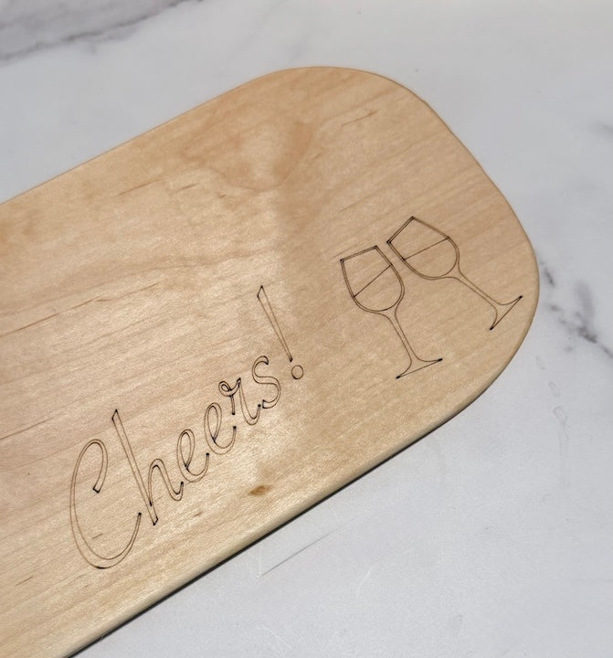 Small Beech Wood Charcuterie Board with engraving of wine glasses and Cheers!